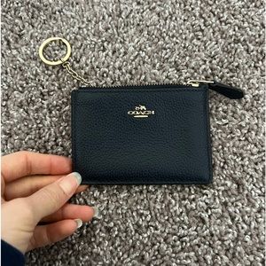 Coach card case with gold hardware